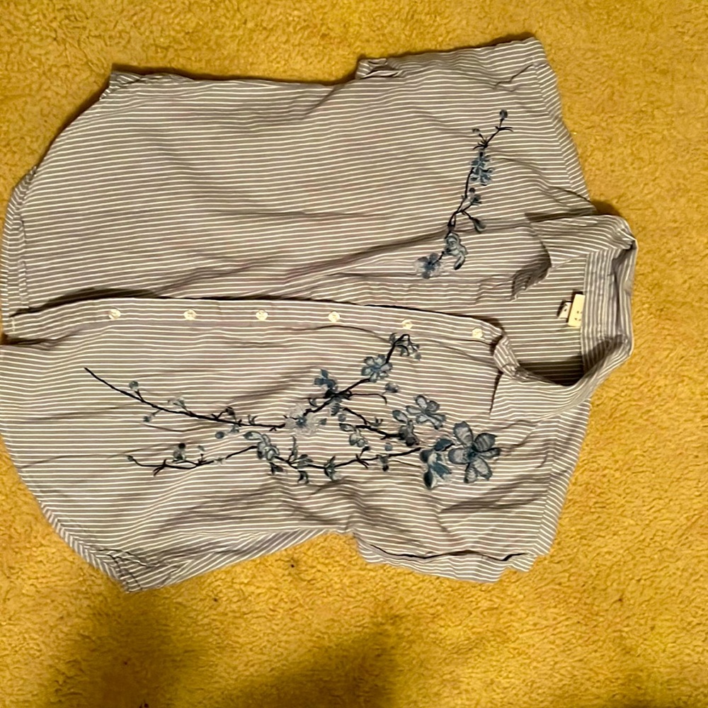 Beautiful spring shirt with embroidered flowers